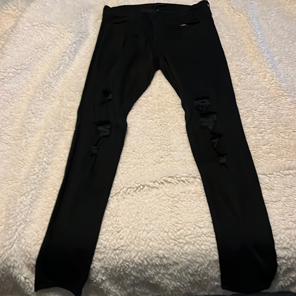 Black Flying Monkey (from buckle) stretch jeans. Size 29.
